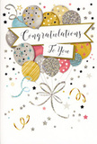 This photograph focuses closely on a tall congratulations card whose design feels like a moment of celebration frozen in mid-air, the sort of card you might tuck beside a hand-tied bouquet before delivering it to a doorstep near Tring railway station. A loose bouquet of illustrated balloons floats in the centre, overlapping in a soft, upward sweep that draws your gaze toward the top edge. The balloons are rendered in a palette of champagne gold, bright silver, pale rose pink, airy sky blue, and soft grey, each outlined and decorated with delicate metallic accents. Some carry glittered stripes, others are dotted with minuscule stars, and a few have a dusting of sparkle that suggests they would catch the light like party decorations reflected in a window along Western Road. Slender, curling tethers in gold and silver ink extend downward, loosely gathered so they appear to trail off the bottom of the card, hinting at an unseen anchor and keeping the composition visually grounded. Around the balloon cluster, an array of tiny stars, swirling ribbons, and confetti flecks spreads across the pale background, giving the card a sense of playful movement similar to confetti tossed at a celebration in a Tring café. Across the middle, a soft, unfurling banner stretches horizontally, carrying the greeting Congratulations To You in graceful, looping script that feels both warm and celebratory. The surface suggests a mixture of smooth card and slightly raised glitter, adding tactile interest and a subtle sheen. Altogether, the image conveys joy, pride, and lightness-an elegant, festive card ideal for recognising life's big moments, from new jobs to exam successes, especially when paired with fresh flowers from a trusted local florist.